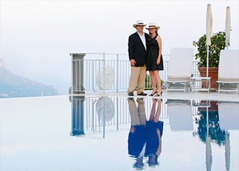 Brad L and his wife near an Infinity Reflecting Pool in Italy