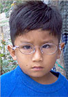 A small boy with eyeglasses
