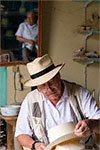 Brent Black examines a hat.