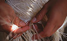 Weaving the brim edge of a Panama hat