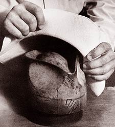 Putting a Panama hat onto a block