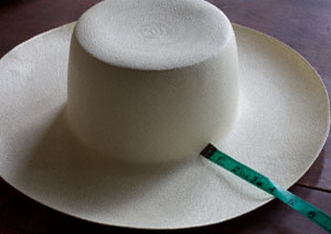 Wide brim unblocked hat with 4 inch brim and a solid crown.