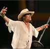 Steven Tyler wearing Brent Black hat in concert.