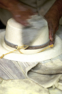 Rubbing sulfur powder into the weave.