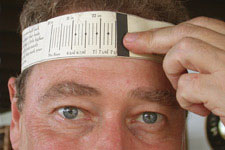 Head with paper tape measure